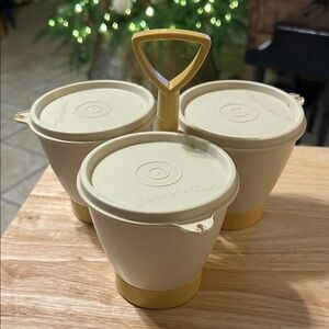 Vintage Tupperware condiment caddy in beige and yellow.